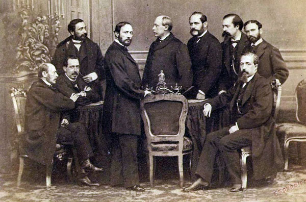 Govern provisional de 1869. Des de l'esquerra: Figuerola, Ruiz Zorrilla, Sagasta, Prim, Serrano, Topete, López de Ayala, Lorenzana i Romero Ortiz